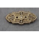 A 14ct yellow gold and diamond geometric brooch, in the Art Deco taste, set numerous round cut