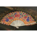 A late 19th century Chinese fan, having carved ivory sticks and guards with peacock feather