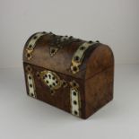 A Victorian dome top burr walnut tea caddy, decorated with engraved gilt metal and bone straps and