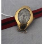 An 18ct. gold ladies' wrist watch, c.1953, manual movement, having engine turned and silvered Arabic