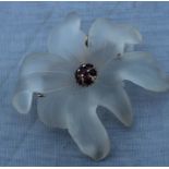 A 14ct. yellow gold, frosted glass and garnet 'flower' brooch. having seven pressed frosted glass