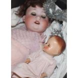 A collection of various dolls including a fine bisque headed doll