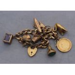 A 9ct. gold curb link charm bracelet, suspending numerous gold charms, the chain impressed "375" and