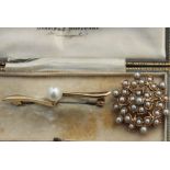 A yellow metal and pearl set circular brooch, of open work design set numerous pearls, (yellow metal