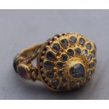 An Indian precious yellow metal, enamel and diamond "poison" ring, having yellow metal shank and