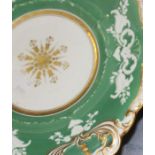 An extensive 19th century porcelain dessert service decorated with green ground and gilt. **