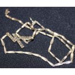 A diamond set pendant necklace, of modern design, having pendant of three rectangular bars set and