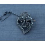 A precious metal and diamond set 25th anniversary witch's heart brooch, the open work brooch with