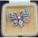 A precious white metal and gem stone set "butterfly" brooch, set round cabochon opal to thorax and