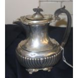 A silver coffee pot, by Reid & Sons, assayed London 1912, of ovoid form, having semi-reeded side,