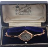 A 9ct. rose gold ladies' bracelet watch, c.1920's, manual movement, having oval Arabic numeral