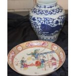 Two Chinese porcelain items to include an mid 18th century large saucer plate decorated along with