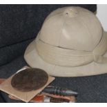 A British WWI khaki pith helmet, together with a WWI memorial plaque, or "Death Penny", and a late