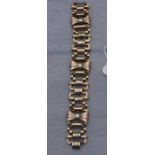 A tri-colour precious metal fancy link bracelet, impressed marks, length 20cm x width 2.6cm. (66.