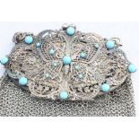 A 19th century white metal mesh purse, the ovoid clasp with filigree work butterfly to centre