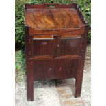 An 18th century mahogany bedside cabinet in Chippendale style