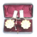 A cased pair of Victoriaan silver circular salts with spoons, by John Milward Banks, Birmingham