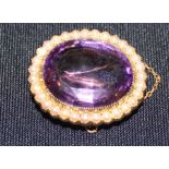 A yellow metal, amethyst and seed pearl oval brooch, having large oval cut amethyst surrounded