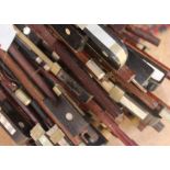 A collection of violin bows