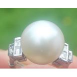 A white metal, South Sea pearl and diamond ring, set large cultured South Sea pearl to centre with