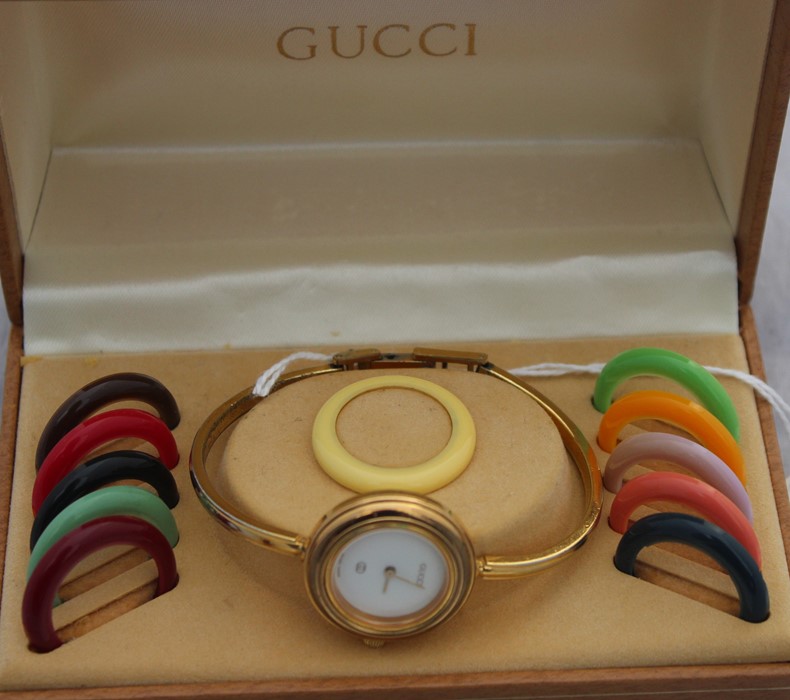 A Gucci ladies' bracelet watch, ref.1100-L, c.1989, having signed white circular dial, 26mm wide