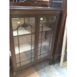 An Edwardian mahogany glazed display cabinet, cream interior three tier shelves on cabriole