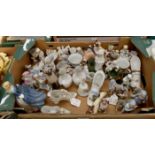A large collection of 19th-century porcelain figures and salts depicting children (Sanson), together