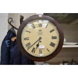 A George VI mahogany cased fusee wall clock, having a white enamelled dial, black Roman numerals