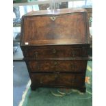 A George II walnut bureau of small proportions with small top drawer above mid rail with further two