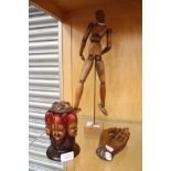 A Japanese wooden artists articulated mannequin along with an articulated wooden hand and a thread