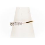 An 18ct gold five-stone diamond ring, total diamond weight approx 0.10ct, claw set set, size O,
