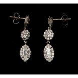 A pair of diamond set drop earrings, comprising two round brilliant cut diamonds and a marquise
