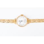 A ladies 9ct gold Record wristwatch, round enamelled dial, subsidiary dial, numbers,  on rolled gold