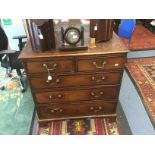 George III oak chest of drawers, two over three brass swing handles