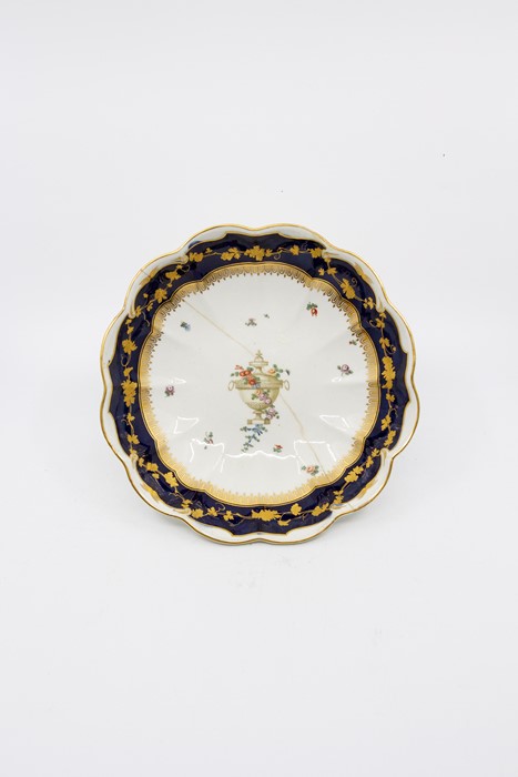 A Derby porcelain dessert bowl, circular, lobed form, circa 1775, central polychrome urn with floral