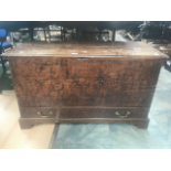 A Georgian mule chest with a single drawer and brass swing handles.