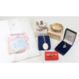 Silver bangle, Birmingham 1964, boxed; commemorative silver Jubilee pendant 1977, boxed; silver