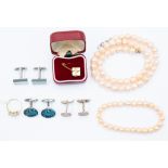 A cultured pearl necklace and matching bracelet, peach tone, along with a gilt metal three stone