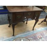 A late 19th Century oak hall table with three drawers