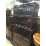 An Early 20th Century mahogany stacked glazed four tier bookcase, stamped with "The Globe-Wernicke