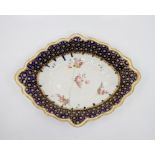 A Derby porcelain lozenge dish, circa 1780, mazarine blue border with gilt polka dot and hexagonal