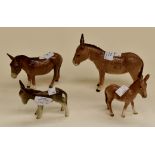 A group of four Beswick donkies including two foals (4) damages