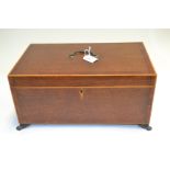 A Regency oak and mahogany crossbanded work casket, boxwood strung, swing handle, metal paw feet