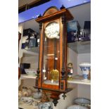 Early 20th Century German mahogany Vienna style wall clock with ebonized features