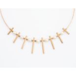 A 9ct gold and pearl collar necklace, comprising eight frosted, graduated tube details to the front,