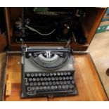 Cased sewing machine with a cased vintage typewriter