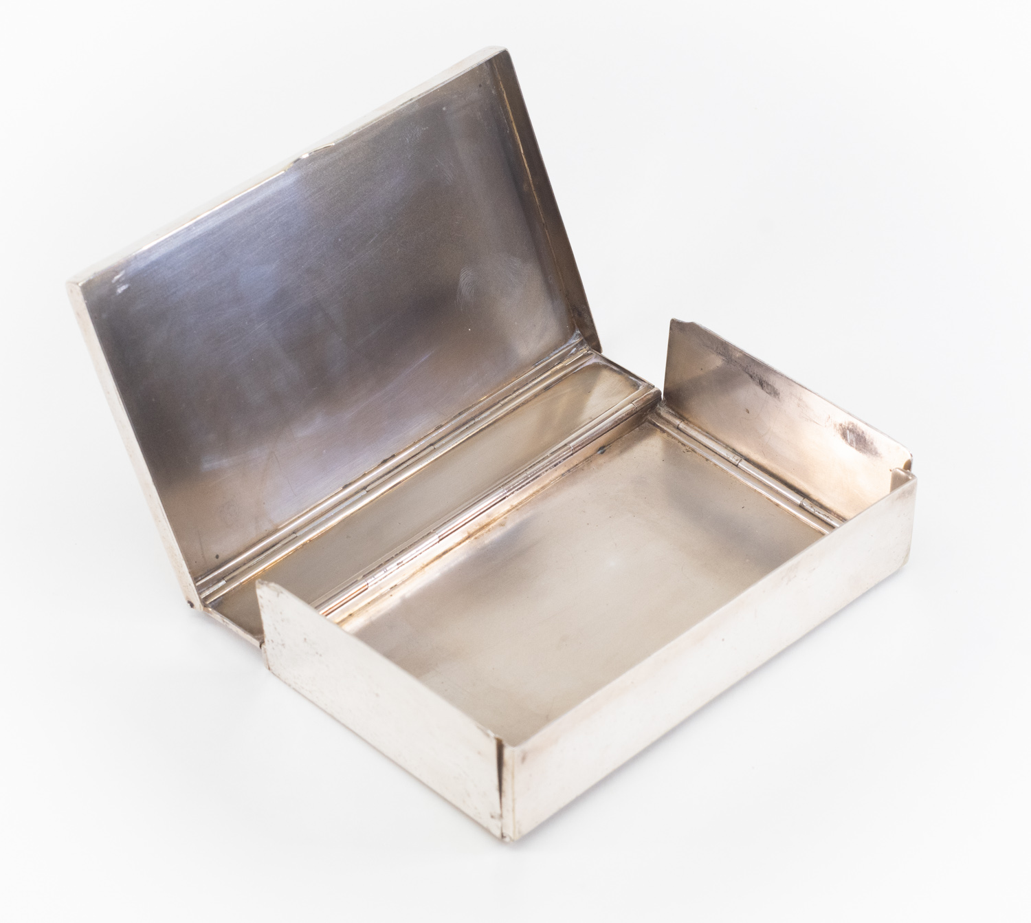 A silver plated folding sandwich box