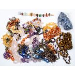 A collection of assorted gemstone chip elasticated bracelets, including carnelian and tigers eye