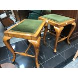 Two stools with green velvet upholstered seats