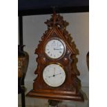 A late Victorian oak desk clock and barometer combined, of Gothic design, signed Hulme,